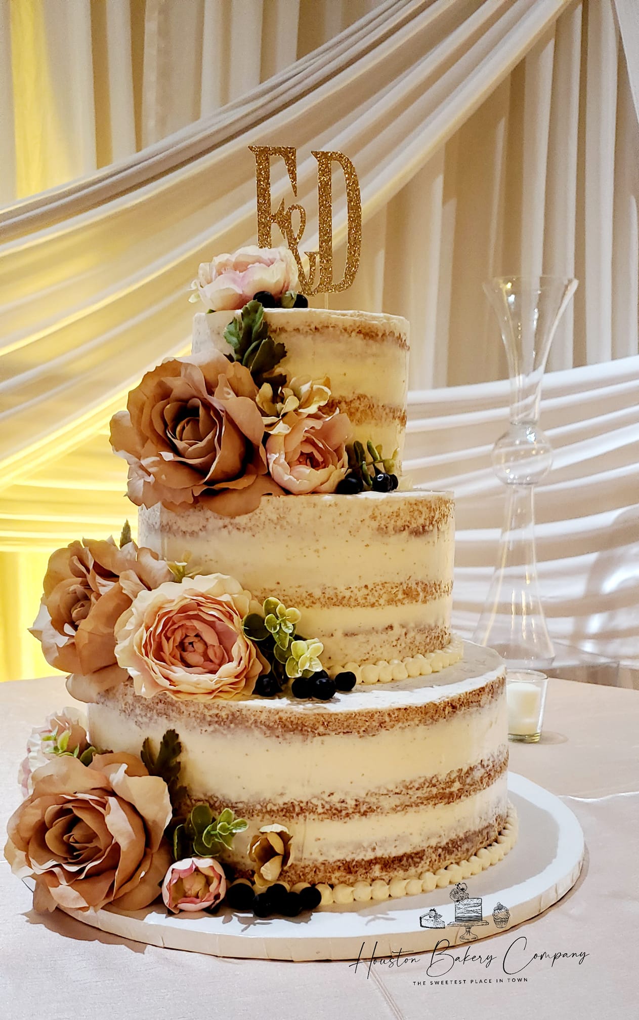Beautiful birthday cake with fresh fruit and 'Happy Birthday' gold topper